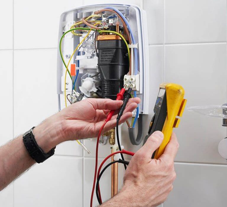 Engineer repairing an electric shower